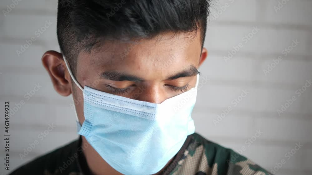 Close up of man with protective face mask looking at camera Close up of man with protective face mask looking at camera
