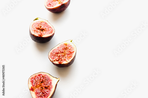 Figs on a white background. Fig halves. Sliced figs.