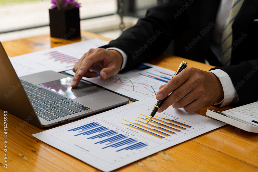 Business finance and accounting concepts using laptops and calculators to analyze, graph, report, budget, and plan for the future in your company's office. Business finance and accounting concepts using laptops and calculators to analyze, graph, report, budget, and plan for the future in your company's office.