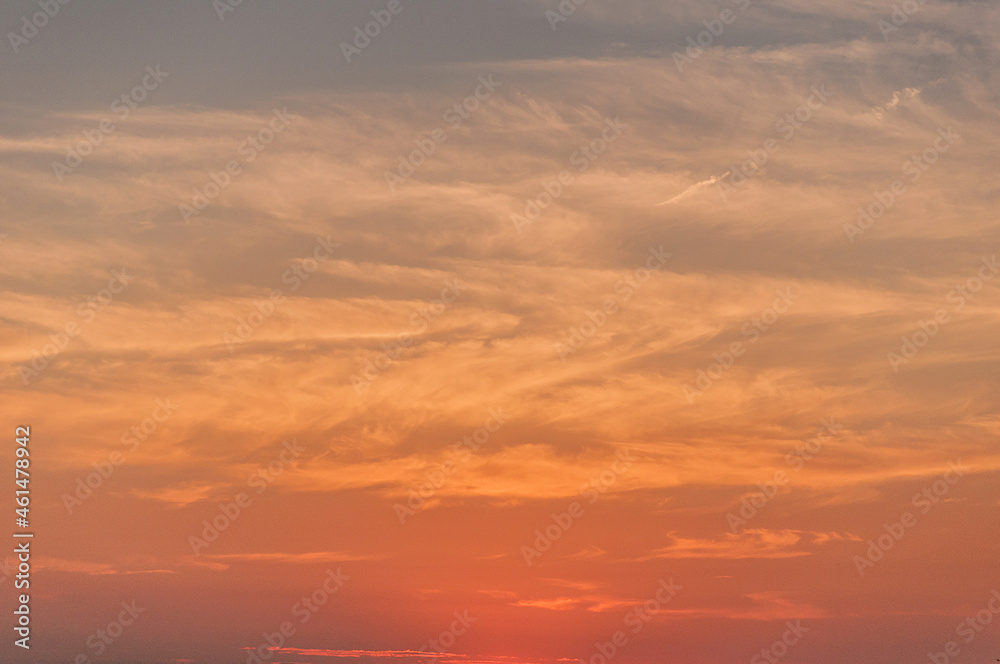 sunset sky above clouds with colorful romantic light.