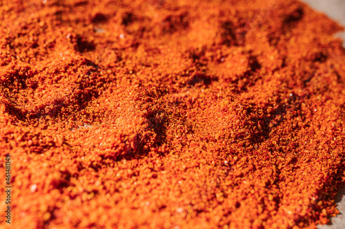 Ground dry chili pepper spices close-up. Soft focus