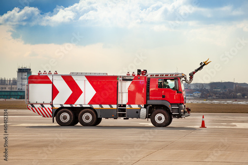 New red fire truck at the airport. Outdoor. Copy space. Transportation car. Airport fire engine