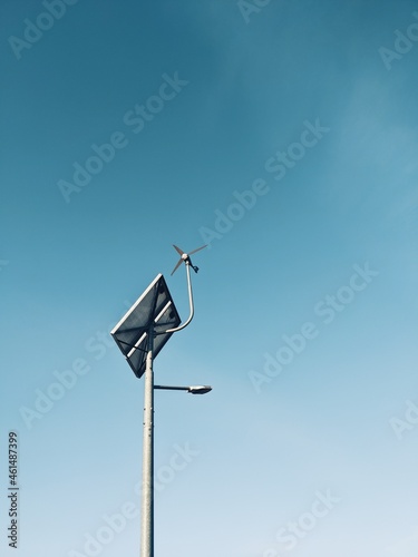 Obraz na płótnie Street lamp on the blue sky, wind turbine and solar panel w salonie
