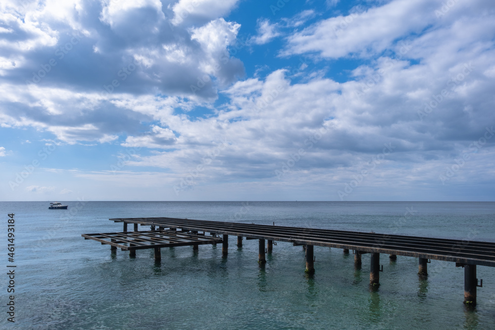Old and rusty metal pier on the seashore. Old and rusty metal pier on the seashore.