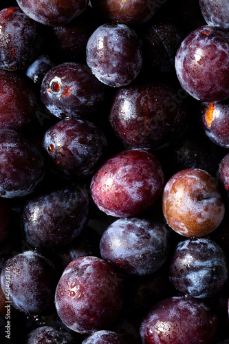 Close up of freshly picked and washed damson plums