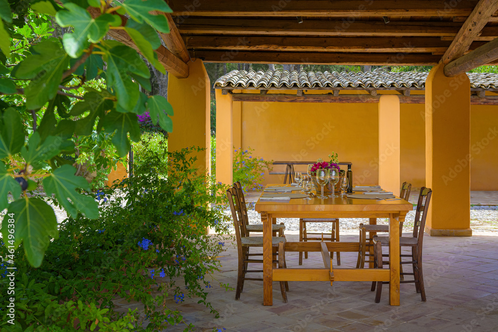 Obraz premium dining table in a mediterranean garden