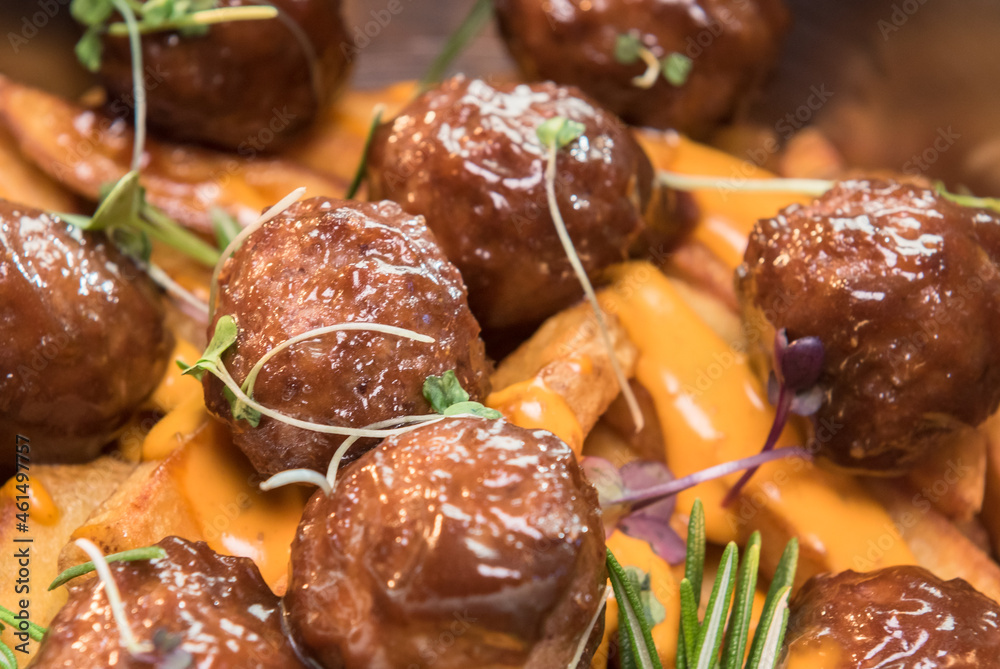 Stewed meatballs in cheese sauce