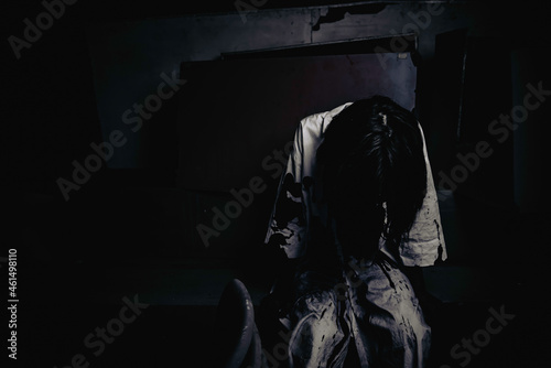 Portrait of asian woman make up ghost face,Horror scene,Scary background,Halloween poster © reewungjunerr