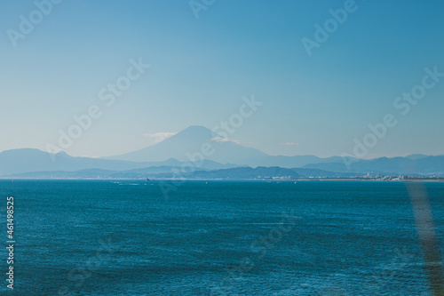 Romantic seascape photo of Japan beach in kannagawa, Enoshima area during golden time and sunset period which be able to see Fuji mountain from here. It's very famous recreational place in summer.