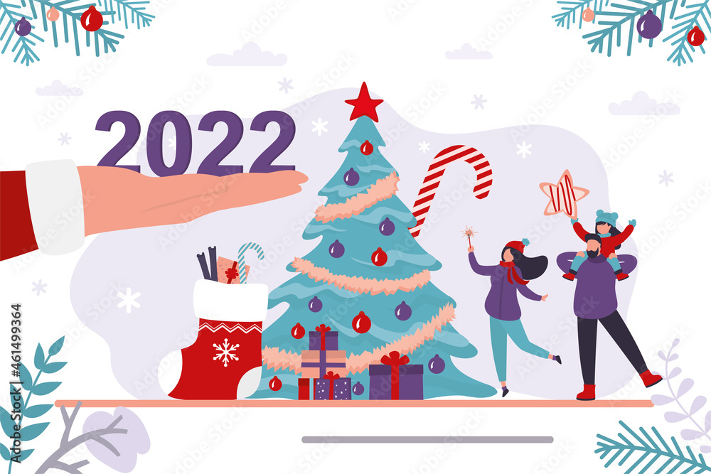 Santa Claus hand gives 2022 year numbers. Happy family near traditional xmas tree, christmas celebration. New year, Santa Claus hand gives 2022 year numbers. Happy family near traditional xmas tree, christmas celebration. New year,
