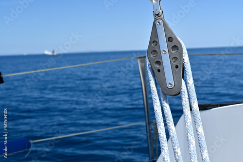 View from a deck of a sail boat. Close up of a downhaul photo