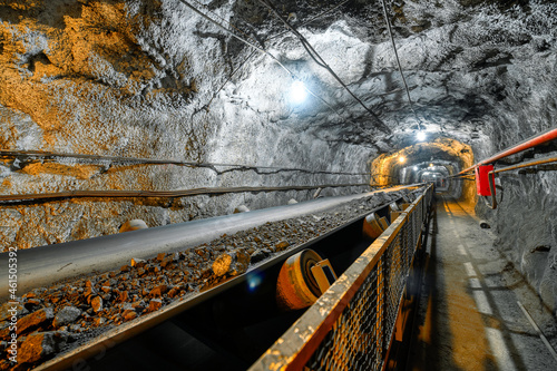 Belt conveyor in an underground tunnel. Transportation of ore to the surface photo