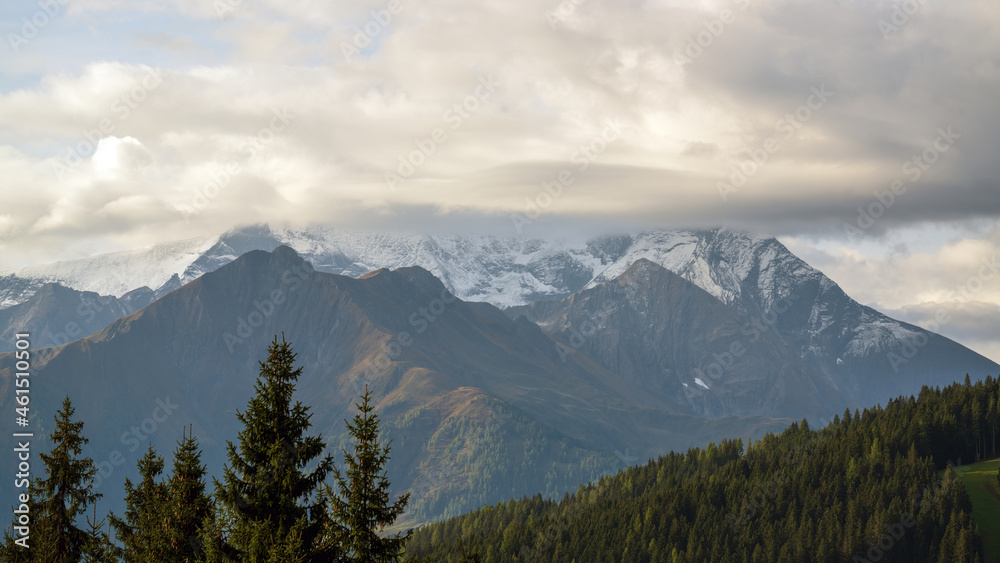 fresh snow in the alps at a autumn morning in october
