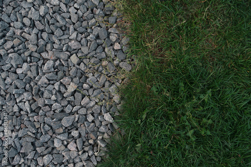 Gravel and grass texture. Grey and green background 