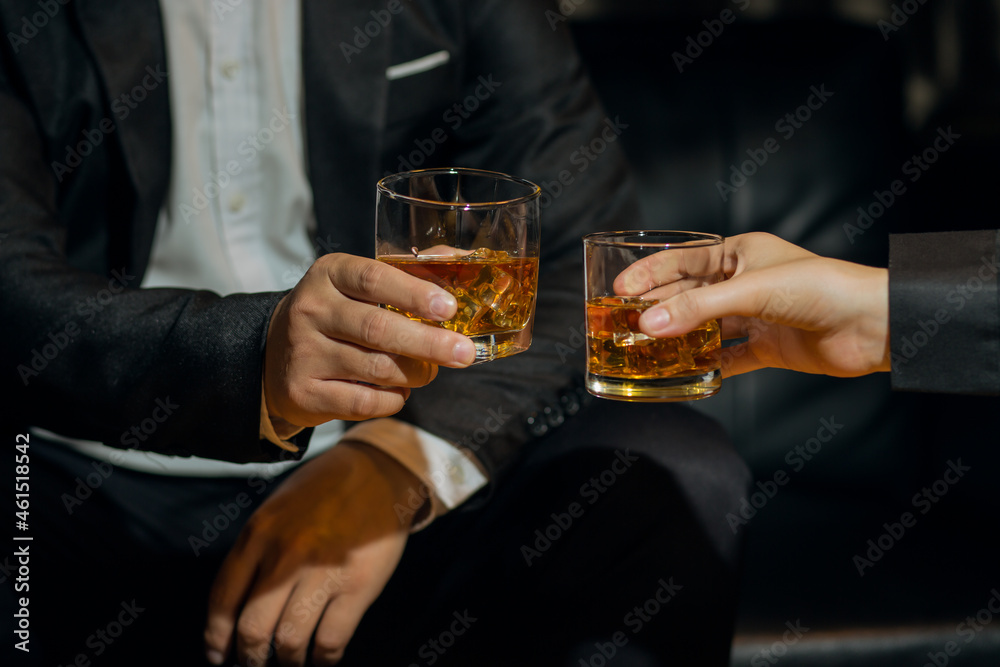 Businessmen in suits drinking Celebrate whiskey Stock Photo | Adobe Stock