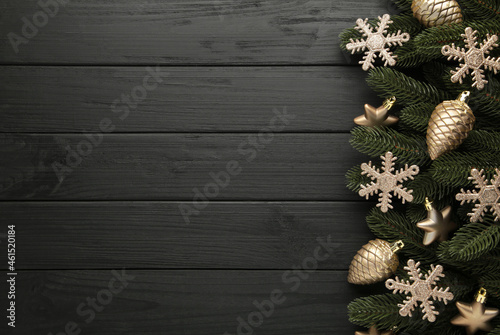 Christmas or New Year gold decoration on black background.