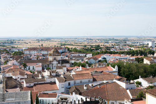 Scenic shot of the cityscape with red-tiled roofs on the buildings in Evora, Portugal photo