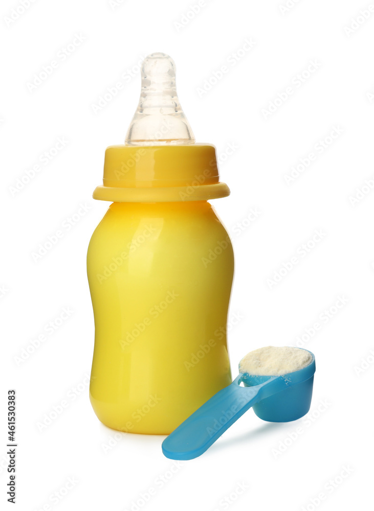Feeding bottle with infant formula and scoop of powder on white background. Baby milk Feeding bottle with infant formula and scoop of powder on white background. Baby milk