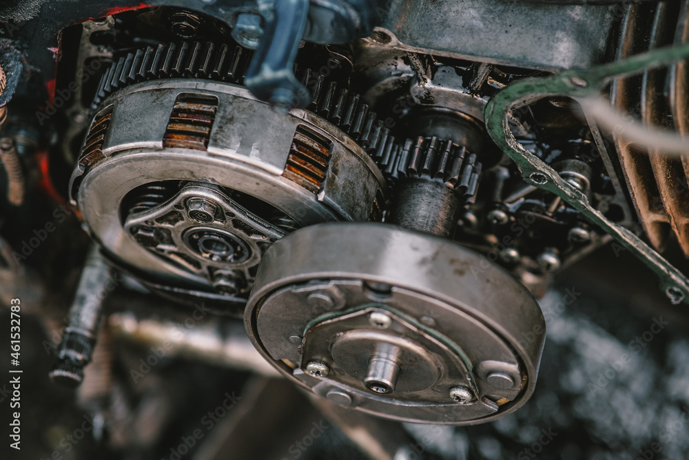 Fototapeta premium Close-up maintenance of motorcycle engine clutch system.