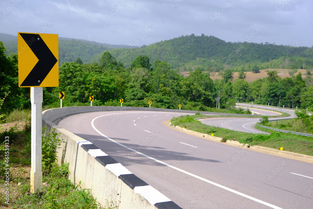 Driving safely on the road with warning signs on the way, dangerous