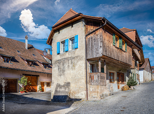 Cobbled street with old houses in the city of Avenches, canton of Vaud, Switzerland