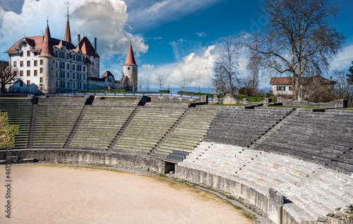 Ancient roman amphitheater and the Avenches castle in the background in the city of Avenches, canton of Vaud, Switzerland