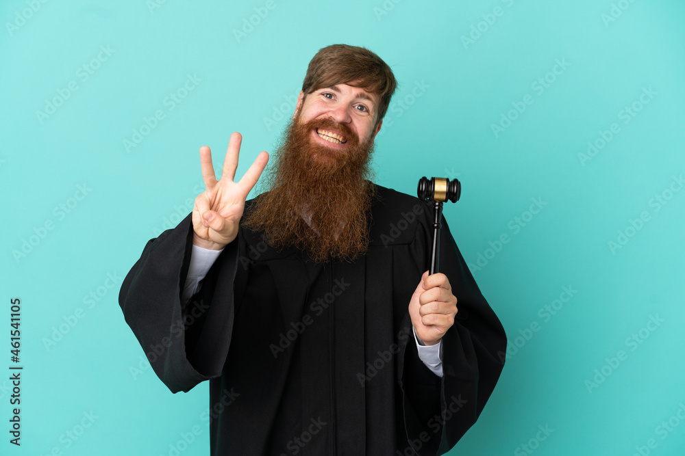Redhead caucasian judge man isolated on blue background happy and counting three with fingers Redhead caucasian judge man isolated on blue background happy and counting three with fingers