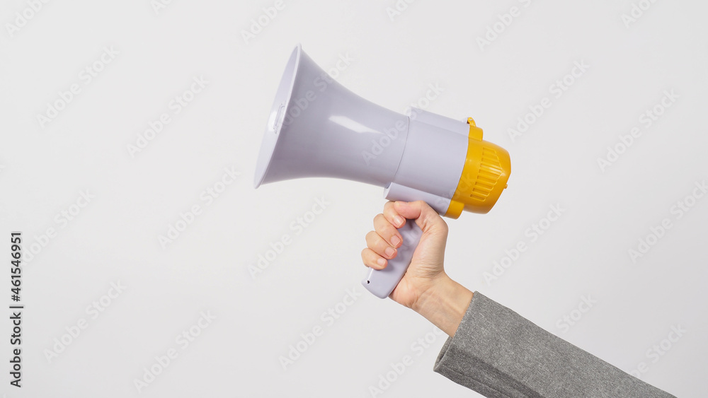 Hand is hold megaphone and wear grey suit on white background.. Hand is hold megaphone and wear grey suit on white background..