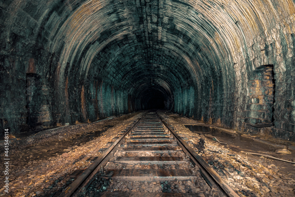 An old abandoned railway tunnel decayed for decades a lost place - obrazy, fototapety, plakaty 