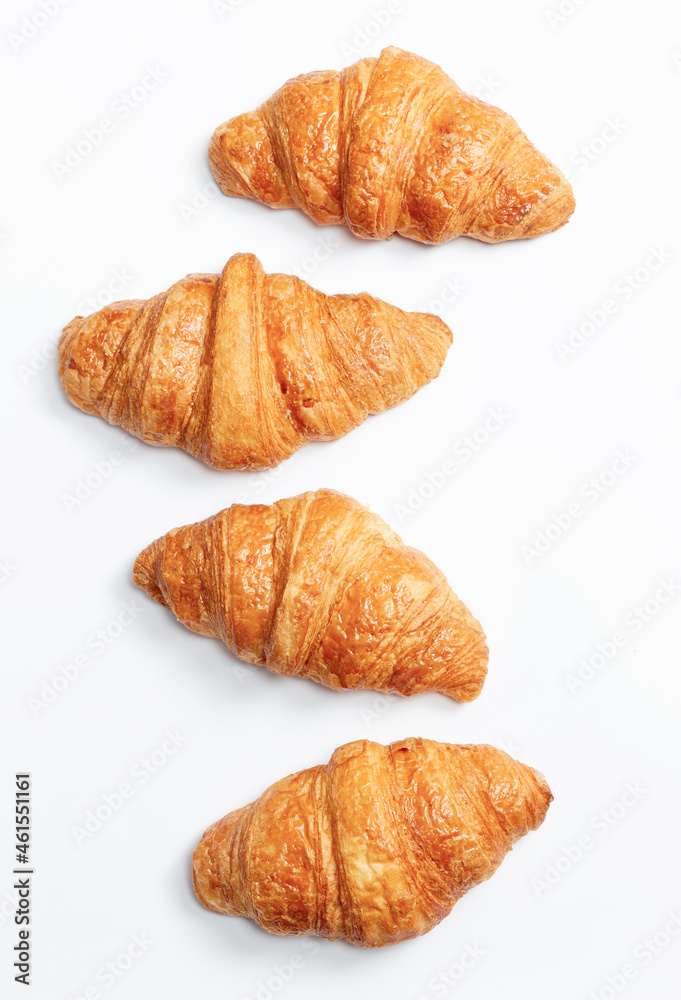 Three croissants on a light background. Three croissants on a light background.