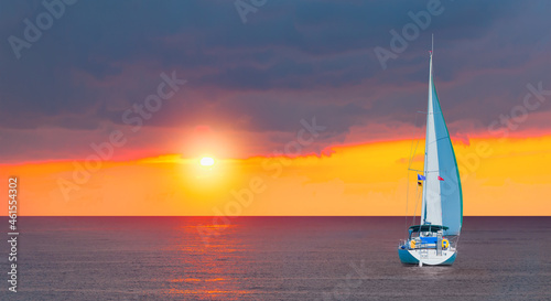 Sailing Yacht from sail regatta on mediterranean sea at sunset - Sailing luxury yacht with white sails in the Sea.