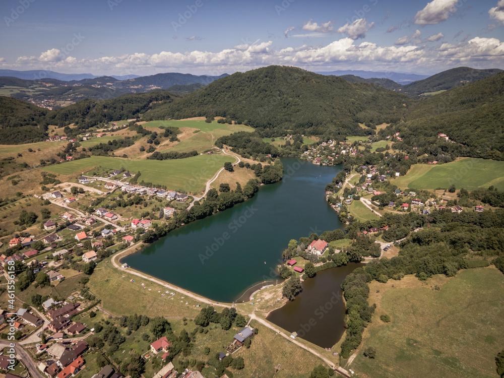 Fototapeta premium Aerial view of a lake in the village of Bansky Studenec in Slovakia