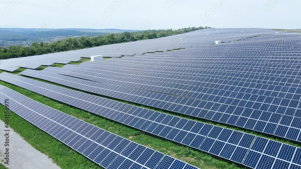 Aerial view of large farm of industrial energy solar panels in field Aerial view of large farm of industrial energy solar panels in field