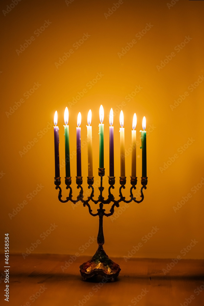 lights the menorah for Hanukkah. Jewish holiday. Tradition is a religious ritual. Sunset. The