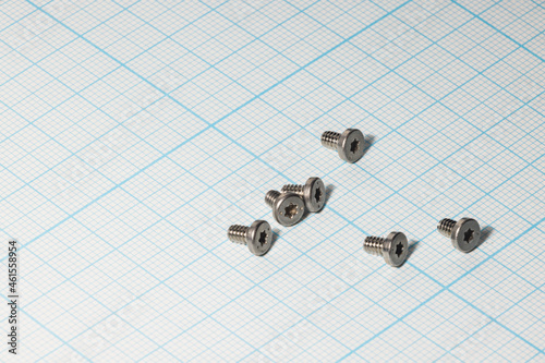Bolts used to assemble computers for small torx on graph paper for drawings. Macro.yf vb