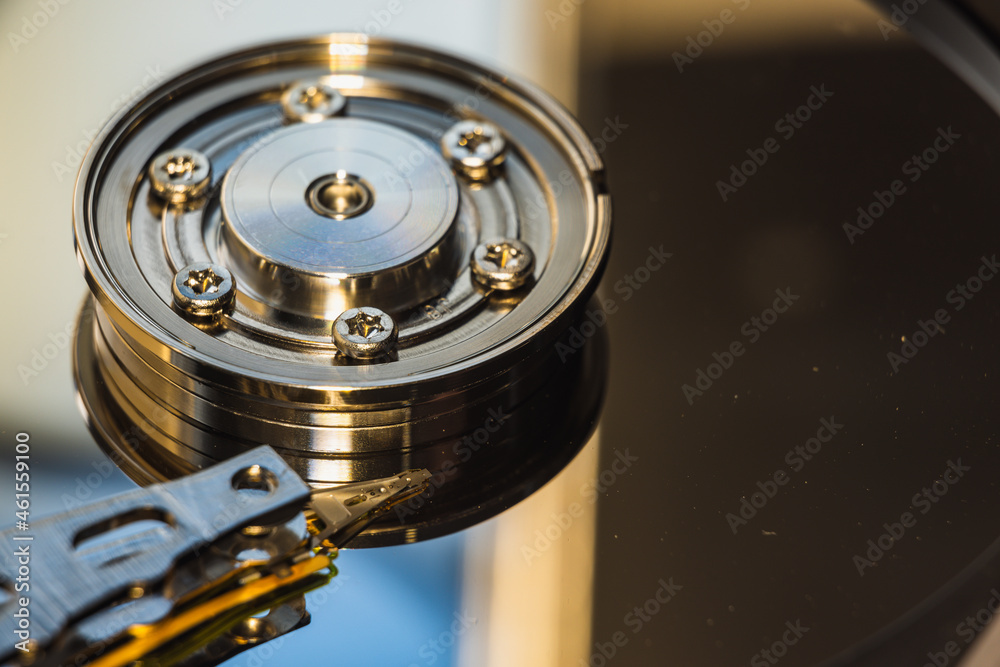 The disassembled HDD spindel with reading/writing head. The disassembled HDD spindel with reading/writing head.