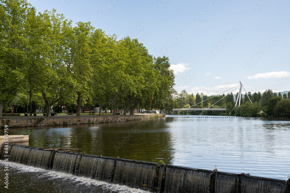 Tamega river in Chaves city urban park with beautiful bridge on the background, in Portugal Tamega river in Chaves city urban park with beautiful bridge on the background, in Portugal