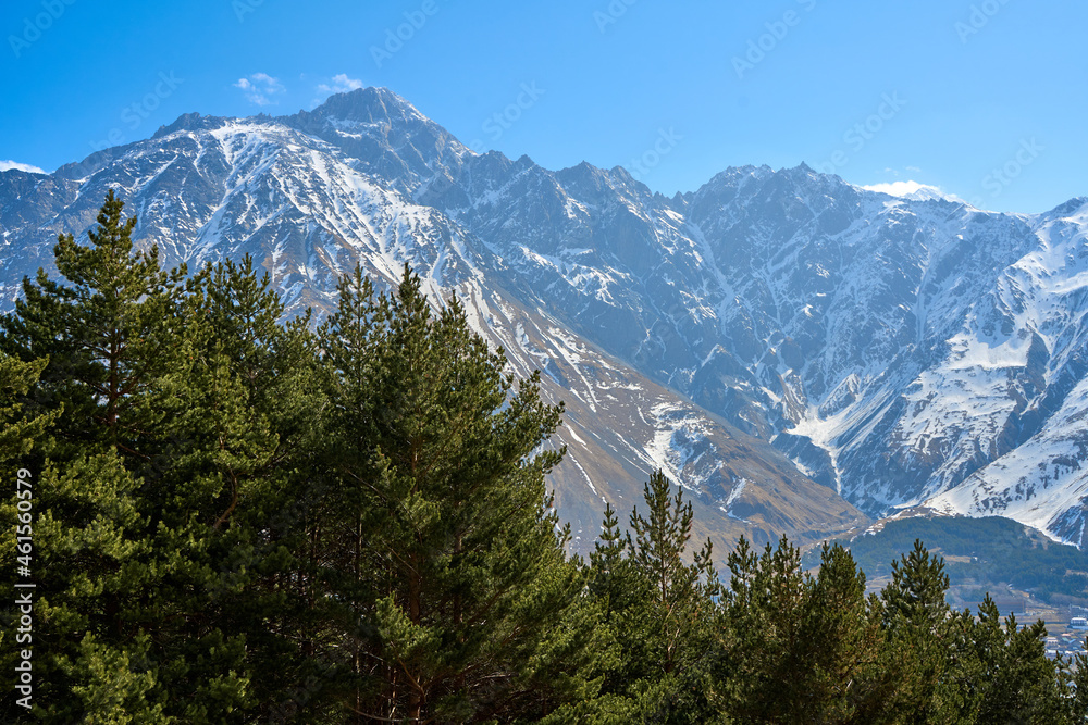 Spectacular mountain landscape. Snow-capped majestic mountains. Early spring