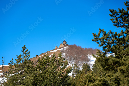 Gergeti Orthodox Church of the Holy Trinity in the mountains of Georgia. An authentic spiritual place photo