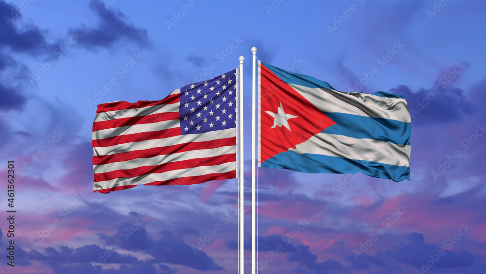 Two waving state flags of United States and Philippines on the blue sky. High - quality business background.