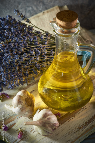 A bottle of organic olive oil on a rustic background