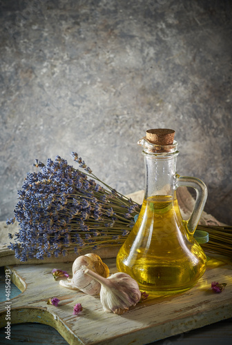 A bottle of organic olive oil on a rustic background