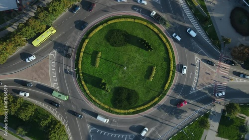 Top view of traffic of people, cars and buses at rush hour at circular junction