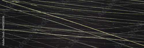 Scratched film texture. Many bright lines in different directions. Panoramic background for grunge and vintage design. photo