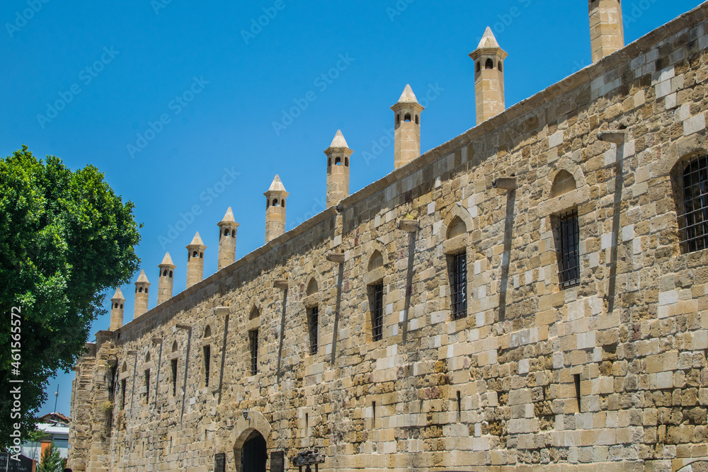 Old Stone building with tall Cylindrical Turkish style chimneys
