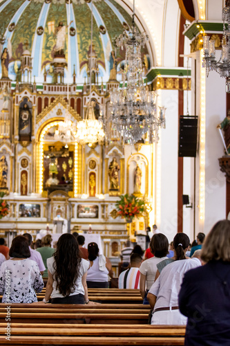 People at the Interior of the Minor Basilica of the Lord of Miracles located in in the Historic Center of the city of Guadalajara de Buga in Colombia