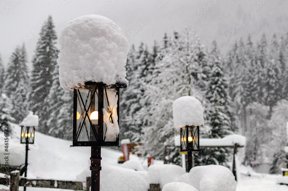 Lamppost covered with fresh snow.l Lamppost covered with fresh snow.l
