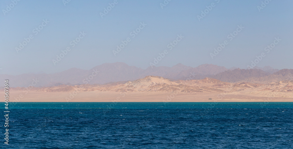 The Red Sea coast. Ras Mohammed National Park. Rocks and mountains of the Sinai Peninsula-Seascape. The Red Sea coast. Ras Mohammed National Park. Rocks and mountains of the Sinai Peninsula-Seascape.
