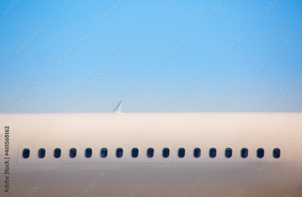 The plane is preparing to fly at the airport. Airplane on the runway at the airport. The turbine of the aircraft is warming up, the landing gear is preparing for flight. The plane flies in the sky. The plane is preparing to fly at the airport. Airplane on the runway at the airport. The turbine of the aircraft is warming up, the landing gear is preparing for flight. The plane flies in the sky.