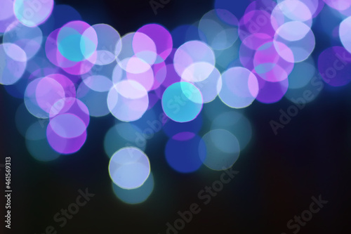 Christmas or New Year festivre blurred background with colorful garland lights photo